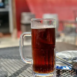 ows a glass of beer on a table