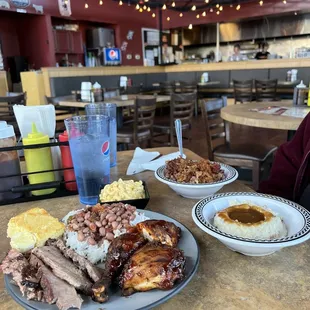 Brisket and chicken with red beans and rice and mashed potatoes with gravy. Dirty rice with pulled pork.