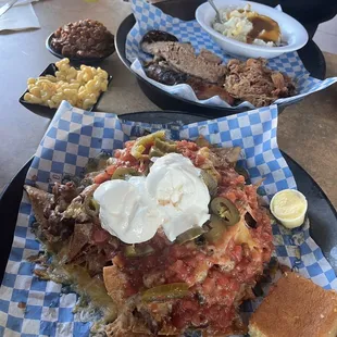 Bbq brisket nacho with corn bread, Mac and cheese, beans, brisket, sausage, pulled pork