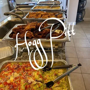 a variety of food on a buffet table