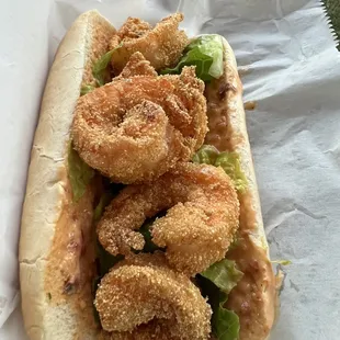 a sandwich with shrimp and lettuce