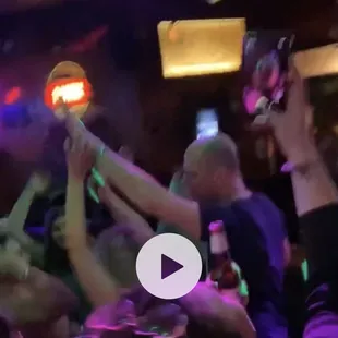 a group of people in a club