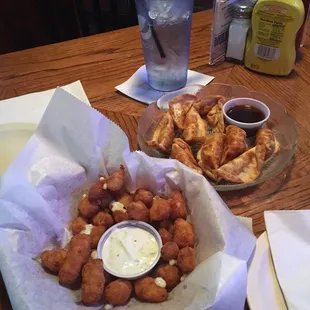 Cheese curds and potstickers.