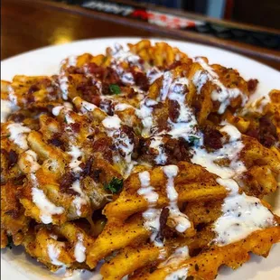 Cajun bacon cheddar loaded waffle fries