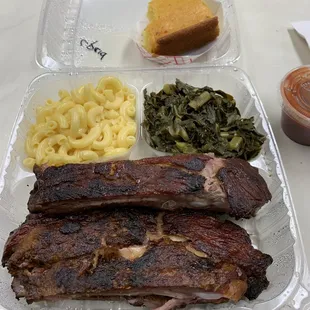 Pork ribs w/ BBQ sauce(decent with sauce), Mac &amp; Cheese (basically just noodles with no flavor), Collard greens (from can and flavorless)