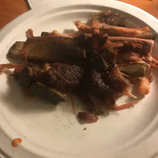 Burnt ribs hidden on bottom of box