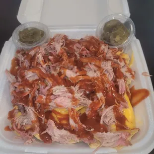 Pulled pork nachos with cheese and BBQ sauce
