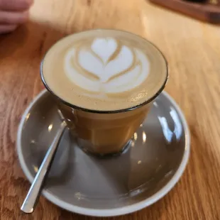 Butterscotch Latte with oatmilk, beautiful microfoam and latte art! The butterscotch sauce is made in-house So warm and wonderful!
