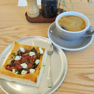 Goat cheese tomato pastry and long black espresso drink