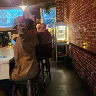 The larger part of the bar and the popcorn machine