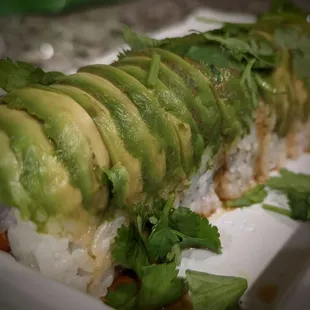 a sushi roll with avocado