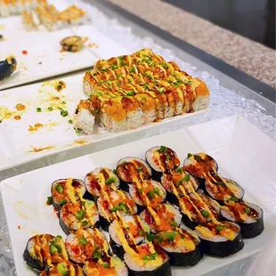 a variety of sushi on plates
