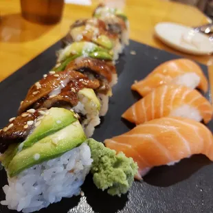 Dragon roll on the left, salmon nigiri on the right