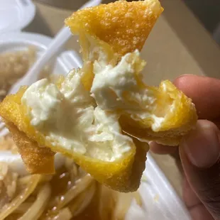 a person holding a piece of food in their hand