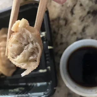 Inside the Gyoza. $6 for a box of six, came with soy sauce. Plain but tasty. 07JUN24