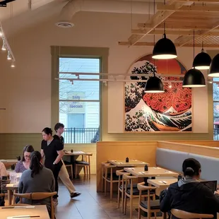 Plentiful seating and a nice spot near the garage door/window, that opens to a courtyard