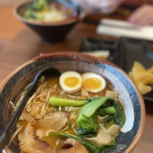 a bowl of ramen with a boiled egg