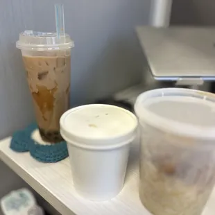 two cups of coffee on a shelf