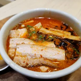 a bowl of ramen and a boiled egg