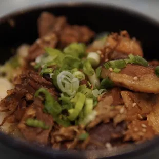 a close up of a bowl of ramen