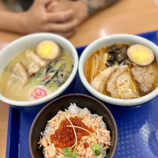 two bowls of ramen and a bowl of soup