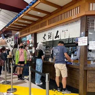 inside the Mitsuwa Mall , on the left