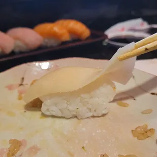 Thinnest slice of fish on negiri that I've ever seen.