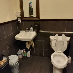 Cleaning supplies and such cluttering the restroom