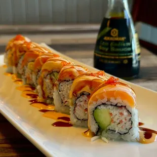 This is a combination of salmon, salmon eggs, avocado, imitation crab sushi roll, Non-torch King Kong Salmon Roll.