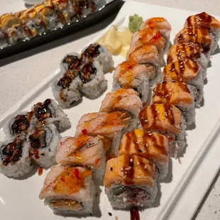 a variety of sushi on a white plate