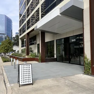 Front Entrance to reach the cafe. Proceed inside the building.