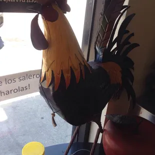 a rooster on a table