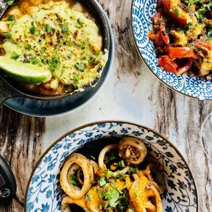 two bowls of food on a table