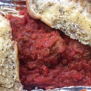 Spaghetti and meatballs with 2 huge pieces of garlic bread. Very good!