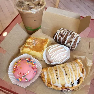 a variety of pastries in a box
