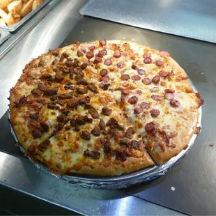 Breakfast Pizza.  Half with sausage and half with chorizo.