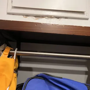 More damage on top of the wood shelving and also missing a pole to hold the clothing up that they threw away