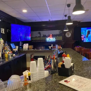 a bar with a large screen