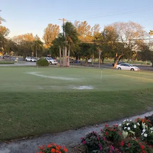 Putting green outside restaurant