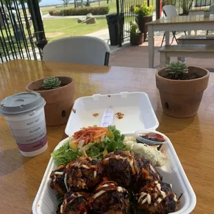 a plate of food and a cup of coffee