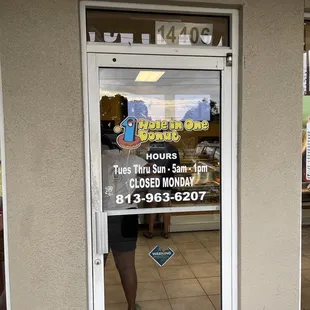 a woman standing in front of the door