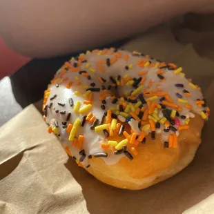 Vanilla frosted donut with Halloween sprinkles