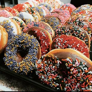 Frosted glazed donuts with sprinkles