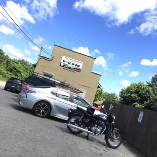 a parked car and a motorcycle