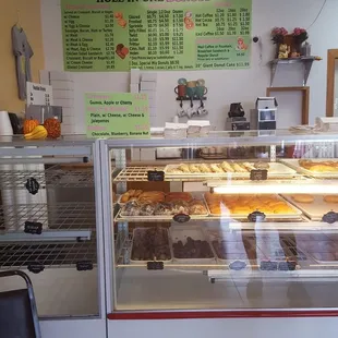 a counter with a variety of pastries