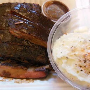 Half a rack of amazing pork ribs and potato salad!