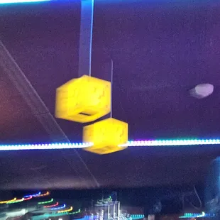 two yellow boxes hanging from the ceiling