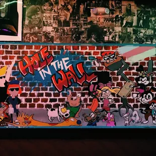 a brick wall with graffiti
