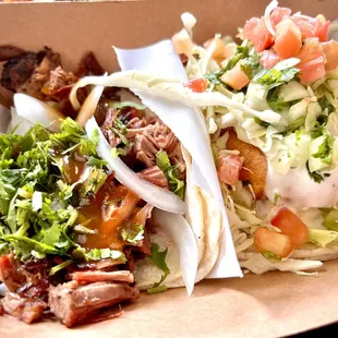 Yummy brisket taco to the left and fish taco to the right