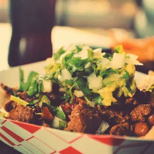 a taco in a paper container